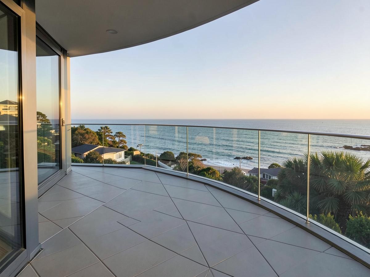 Tiled balcony with sealed perimeter joints overlooking the coast